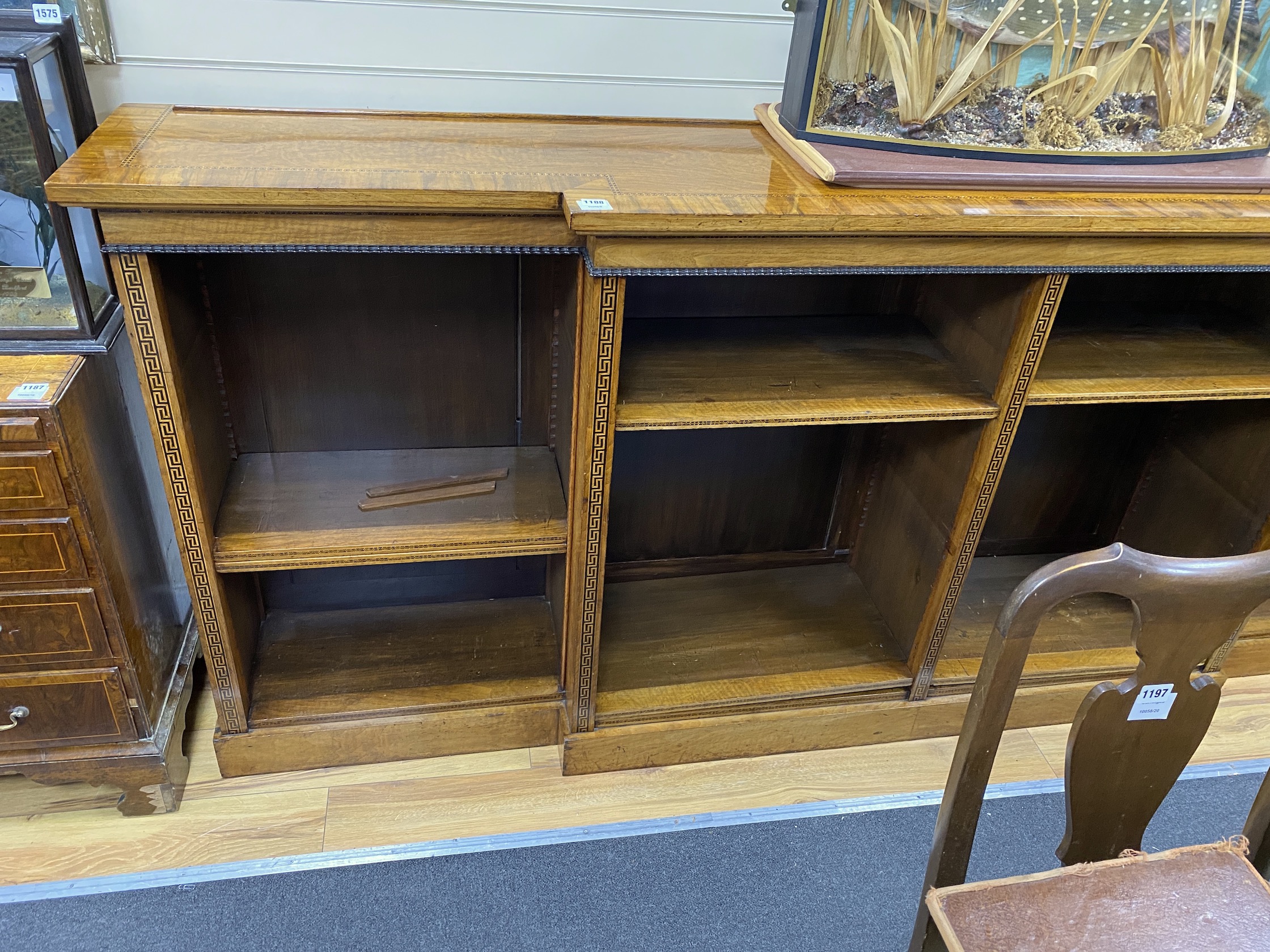 A Regency style banded inlaid walnut breakfront dwarf bookcase, width 266cm, depth 45cm, height 109cm